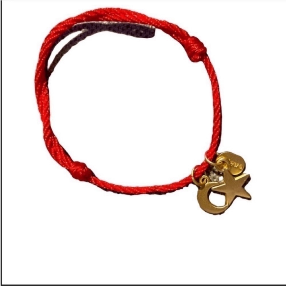 NWOT Jewa red cord with golden moon and star charms bracelet.